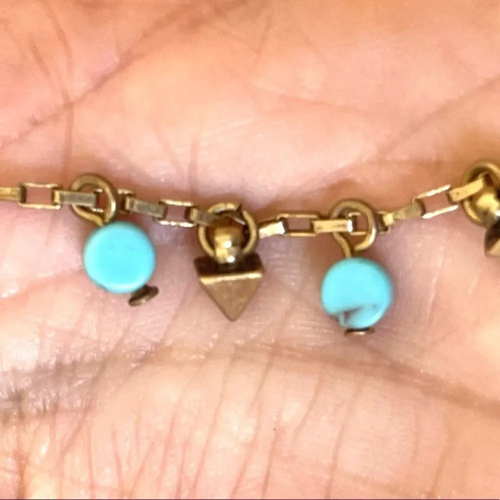 Loft gold tone and turquoise charm bracelet